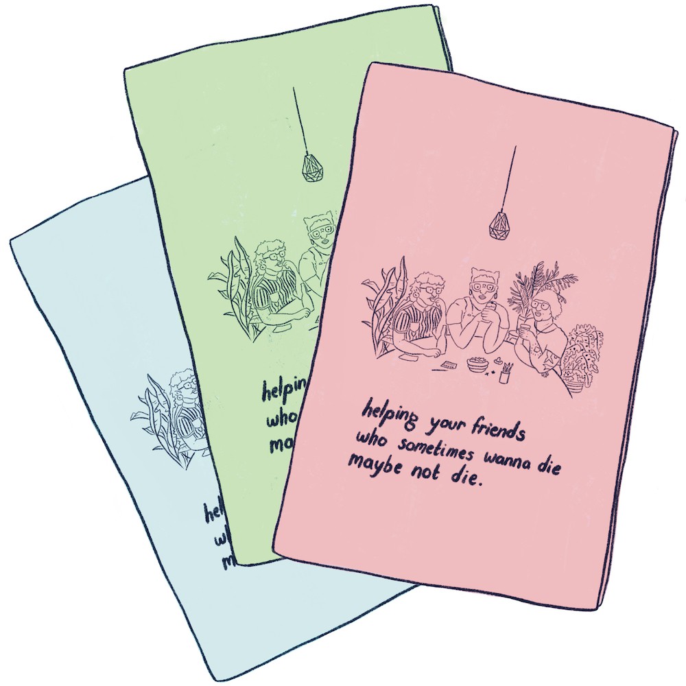 A digital illustration of three zines fanned out. One is light blue, one is light green, and one is light red. On the cover of the frontmost zine, it says
