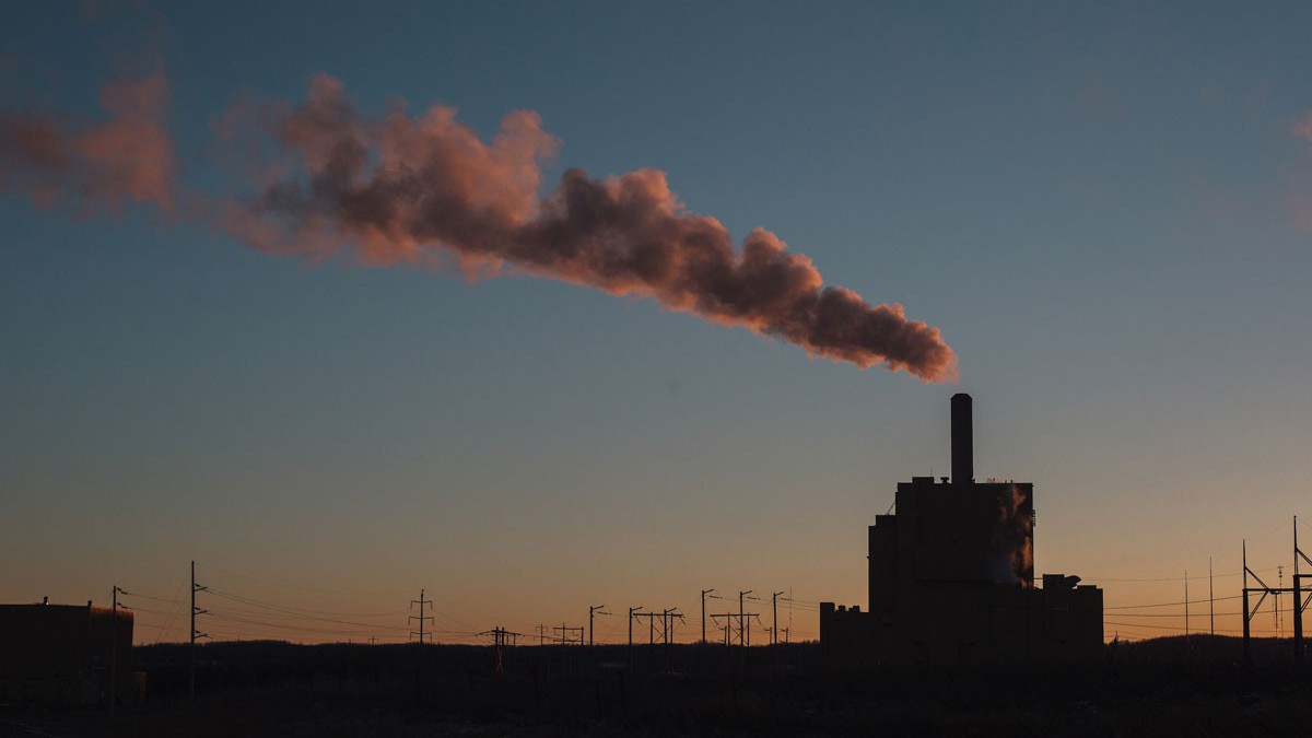 A plume of smoke billows out of the coal fired Keephills Power Station in Wabamun, Alberta at sunset.