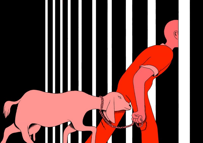 A person in an orange jumpsuit leads a goat, attached by a chain around its neck, through the bars of a prison cell.