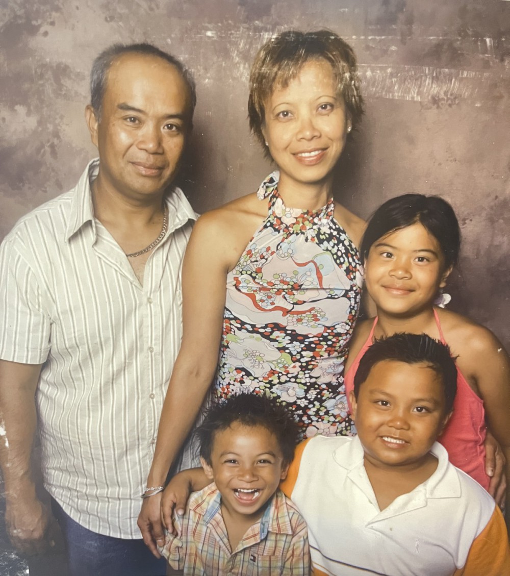 The author’s family posing for a family portrait. Photo courtesy of Adam Arca.