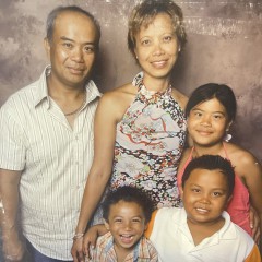 The author’s family posing for a family portrait. Photo courtesy of Adam Arca.