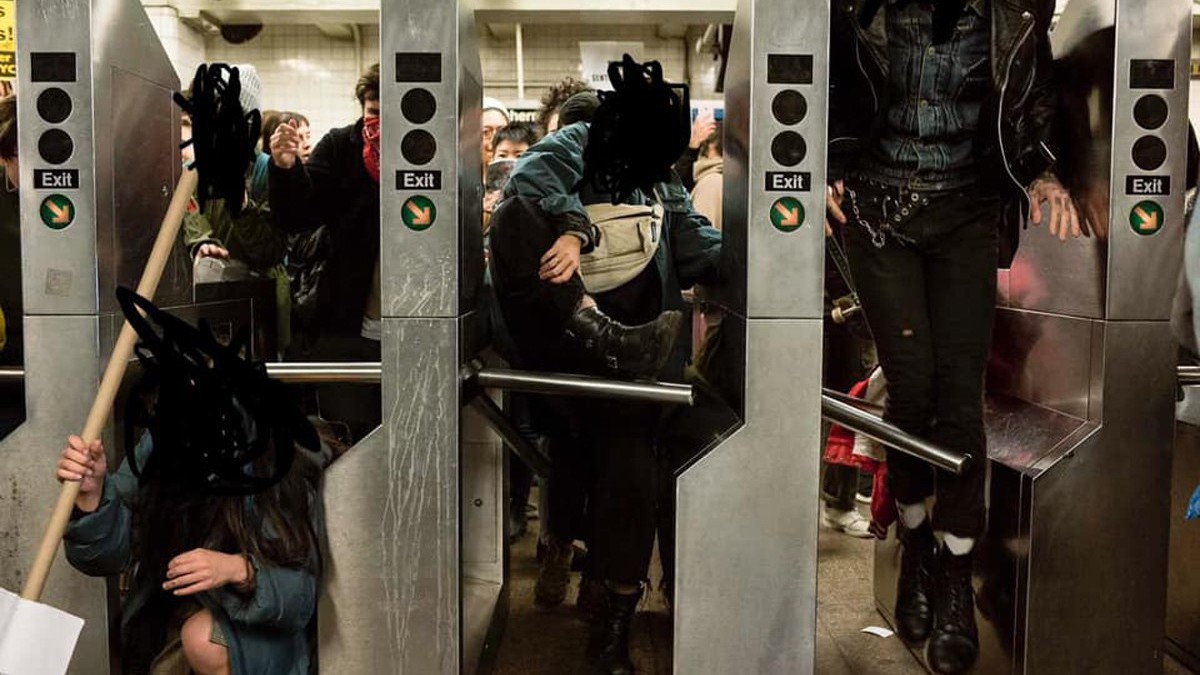 Three people duck under or jump over subway turnstiles. Their faces are blacked out.